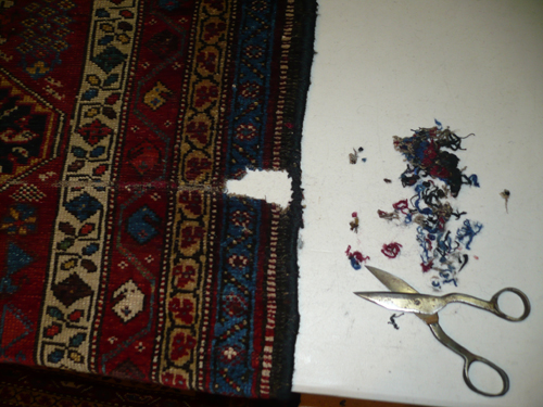 Worn rug area before repair