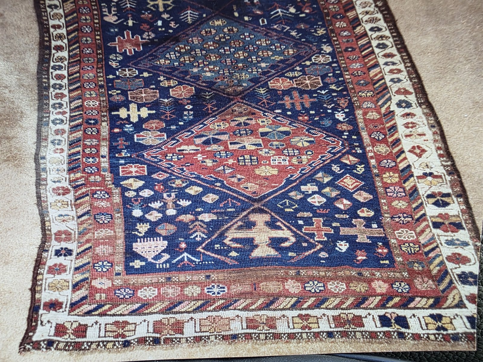 Blue Oriental rug after the damaged area was completely restored